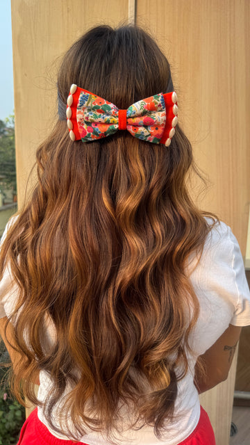 Orange floral traditional bow