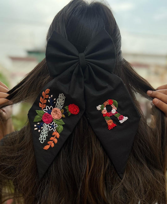 Black floral embroidered bow with initial