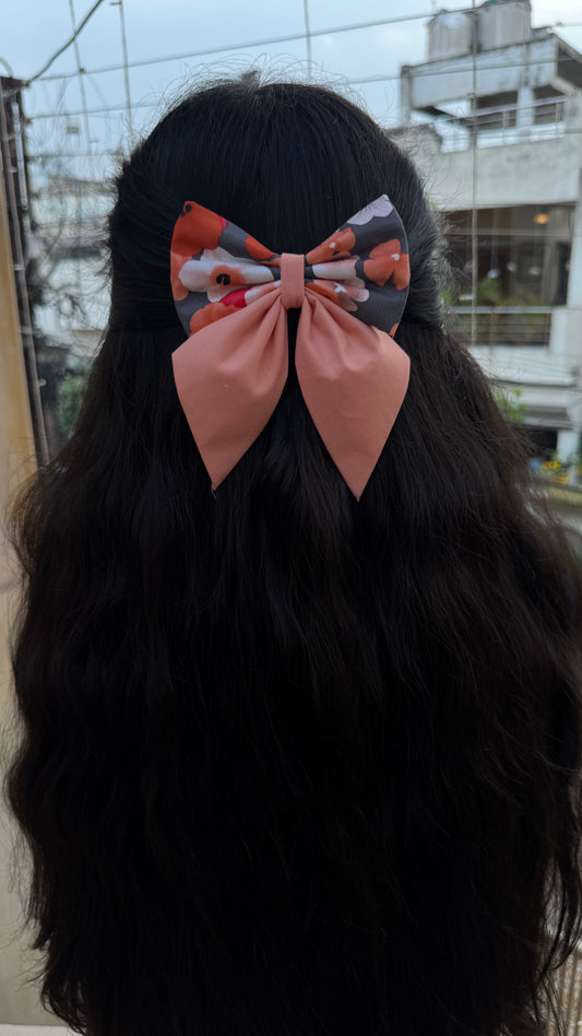 Peach floral pigtail bow