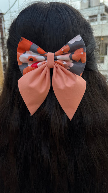Peach floral pigtail bow