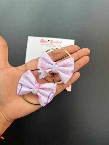 Purple heart bow earring