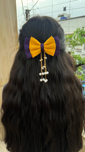 Yellow purple hanging pearl bow