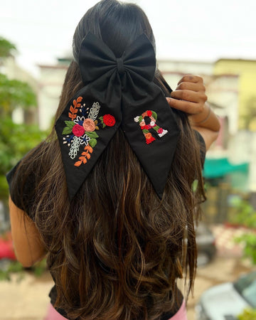 Black floral embroidered bow with initial