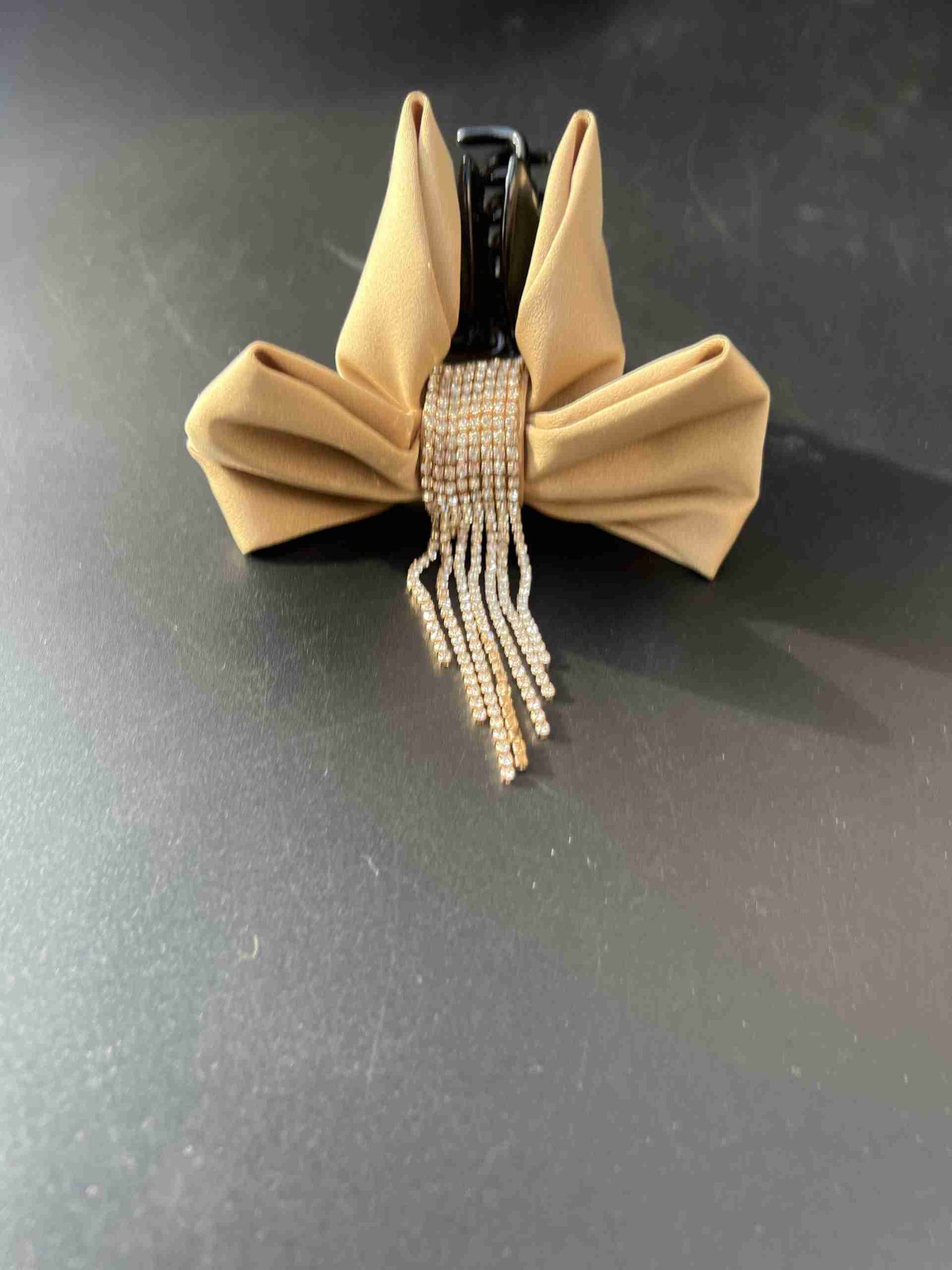 beige stone bow claw clip