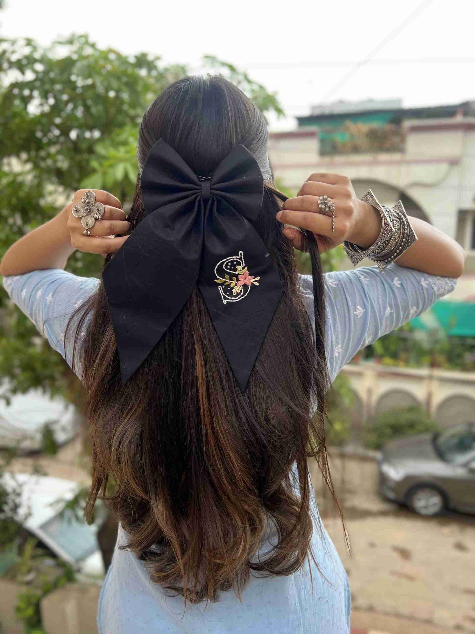 black embroidered initial bow