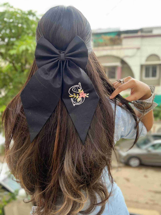black embroidered initial bow