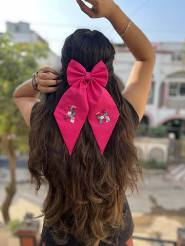 Pink embroidered bow with initials