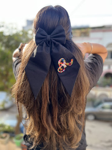 Black embroidered bow with initial