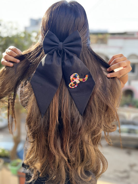Black embroidered bow with initial