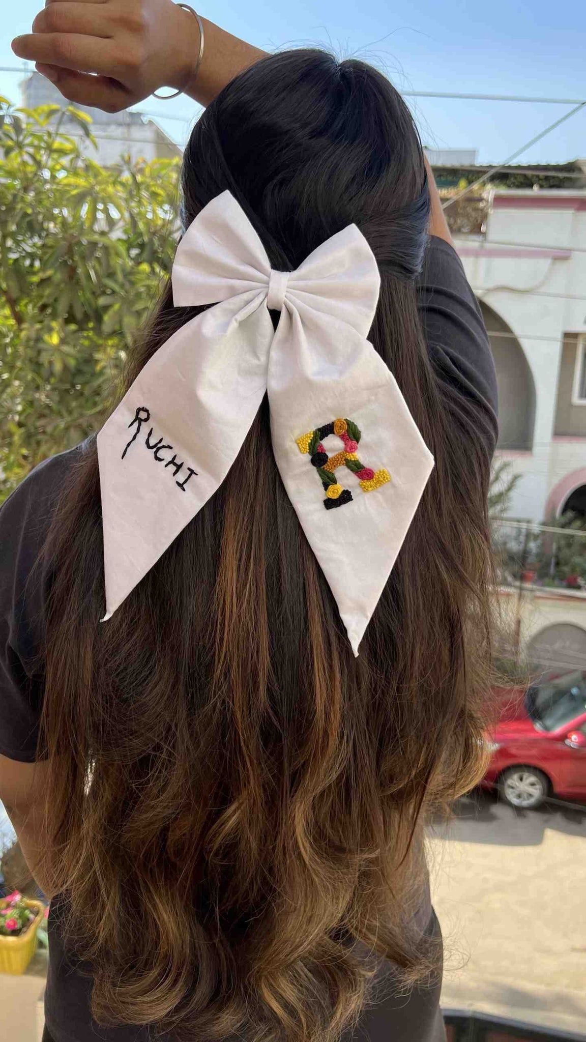 White embroidered bow with name &  initial