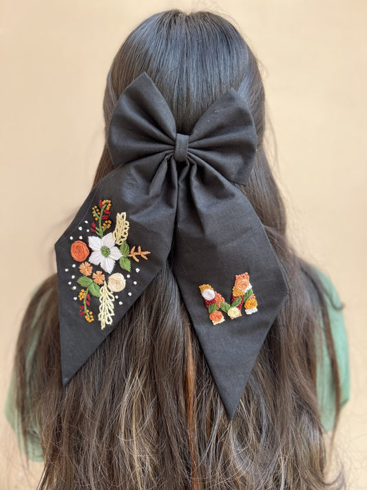 black floral embroidered with initial