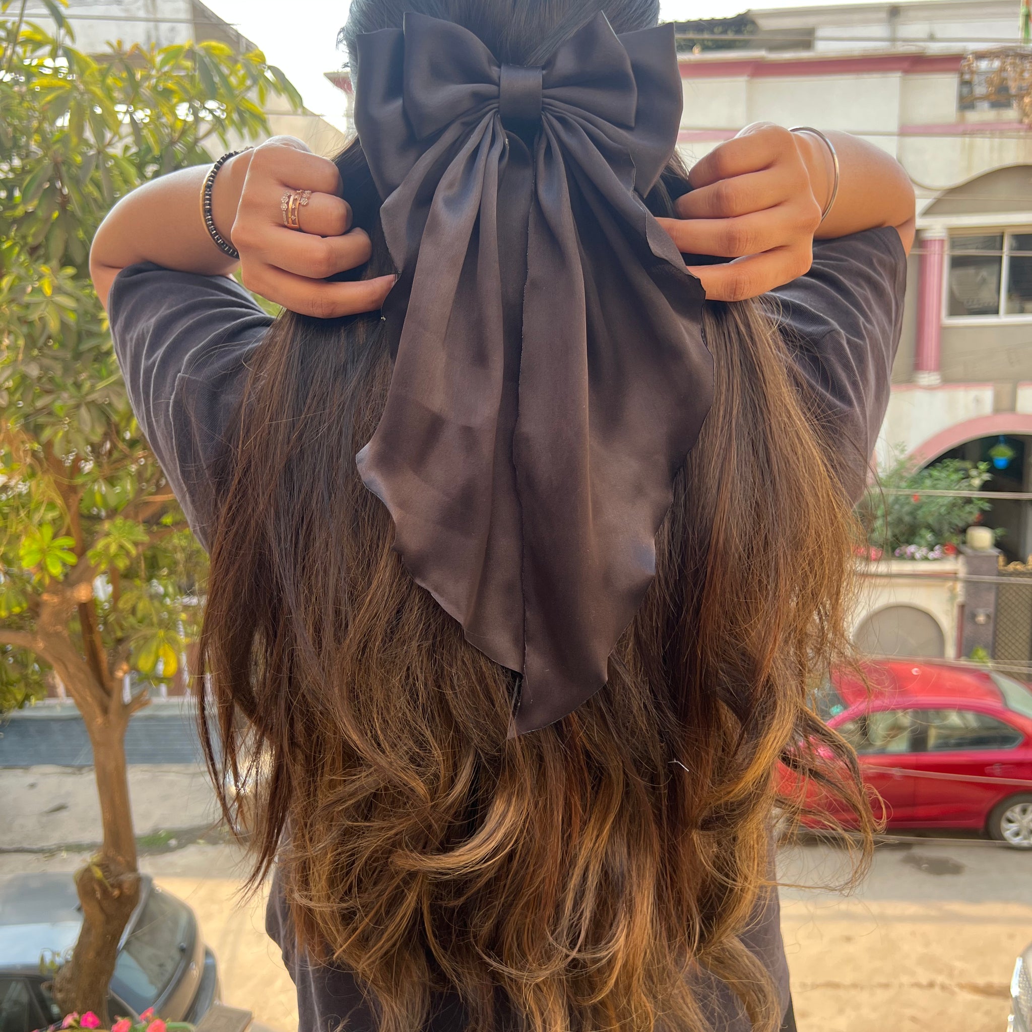Black ruffle bow clip