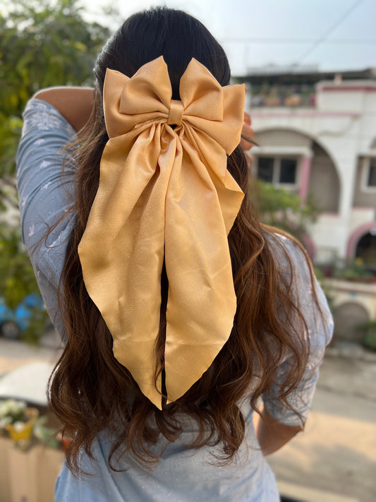 Golden ruffle bow